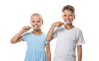 Children brushing teeth on white background